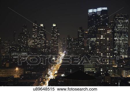 USA, New York State, New York City, Manhattan illuminated at night View Large Photo Image Stock Photography - USA, New York State, New York City, Manhattan illuminated at night. Fotosearch