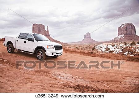 USA, Utah, pick-up track on desert road View Large Photo Image Stock Photo - USA, Utah, pick-up track on desert road. Fotosearch