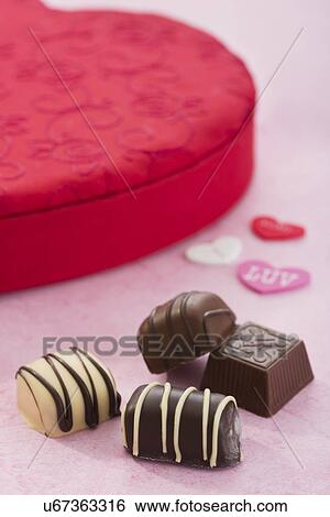 Valentines day presents, heart, chocolates View Large Photo Image Stock Photograph - Valentines day presents, heart, chocolates. Fotosearch