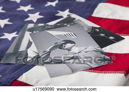 Stock Image - Veterans photos against American flag. Fotosearch