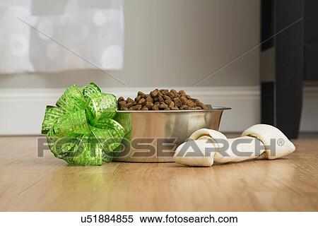 Stock Photography - View of dog food and bone at Christmas. Fotosearch