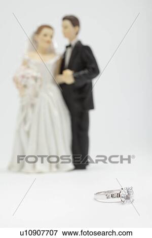 Wedding figurines and silver ring, studio shot View Large Photo Image Stock Photo - Wedding figurines and silver ring, studio shot. Fotosearch
