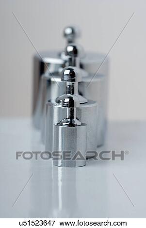 Stock Photo - Weights in a row. Fotosearch