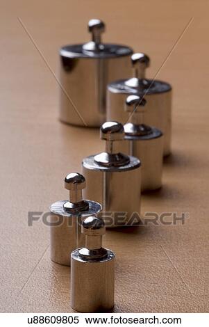 Weights in a row View Large Photo Image Stock Photography - Weights in a row. Fotosearch