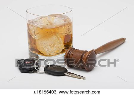 Stock Image - Whiskey gavel and car keys. Fotosearch