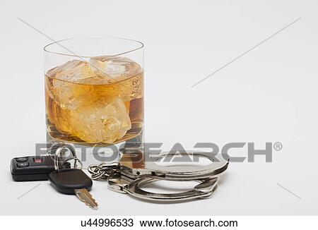 Whiskey handcuffs and car keys View Large Photo Image Stock Image - Whiskey handcuffs and car keys. Fotosearch