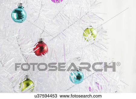 White Christmas tree with multi colored baubles View Large Photo Image Stock Image - White Christmas tree with multi colored baubles. Fotosearch