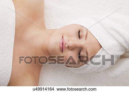 Picture - Woman lying down in spa . Fotosearch