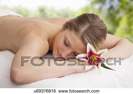 Woman lying down in spa View Large Photo Image Stock Photograph - Woman lying down in spa . Fotosearch