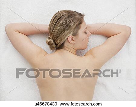 Stock Image - Woman lying in spa. Fotosearch