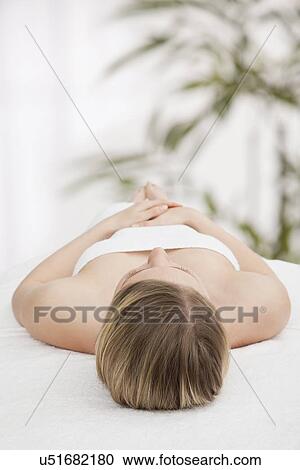 Woman lying in spa View Large Photo Image Stock Image - Woman lying in spa. Fotosearch