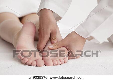 Woman receiving foot massage View Large Photo Image Stock Photograph - Woman receiving foot massage. Fotosearch