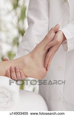 Woman receiving foot massage View Large Photo Image Stock Photography - Woman receiving foot massage. Fotosearch