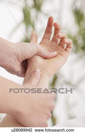 Woman receiving hand massage View Large Photo Image Stock Image - Woman receiving hand massage. Fotosearch