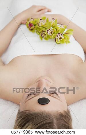 Woman receiving la stone therapy View Large Photo Image Stock Photography - Woman receiving la stone therapy. Fotosearch