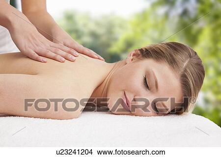Woman receiving massage View Large Photo Image Picture - Woman receiving massage. Fotosearch