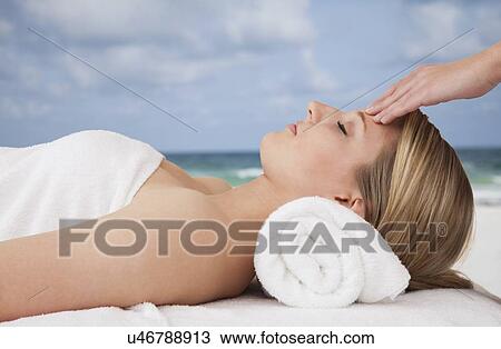 Woman receiving massage View Large Photo Image Stock Image - Woman receiving massage. Fotosearch
