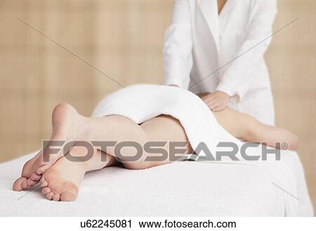 Stock Image - Woman receiving massage. Fotosearch