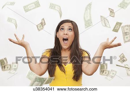 Stock Image - Woman throwing banknotes. Fotosearch