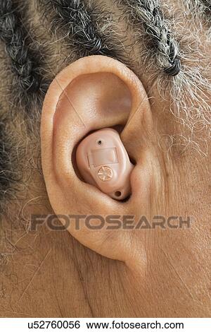 Woman with hearing aid, close up View Large Photo Image Stock Photograph - Woman with hearing aid, close up. Fotosearch