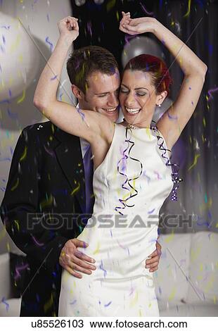 Young couple dancing during New Year's Eve party View Large Photo Image Stock Image - Young couple dancing during New Year's Eve party. Fotosearch