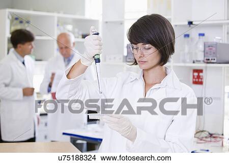 Picture - Young female scientist. Fotosearch
