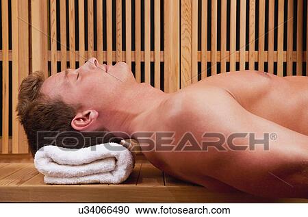Young man in sauna View Large Photo Image Stock Image - Young man in sauna. Fotosearch