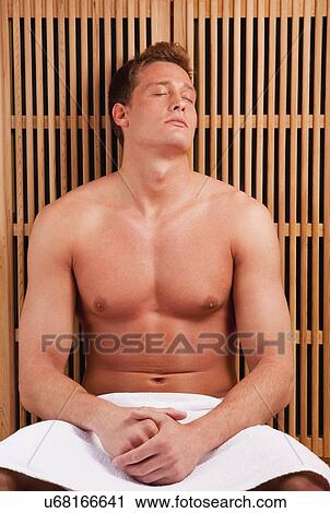 Young man in sauna View Large Photo Image Stock Image - Young man in sauna. Fotosearch