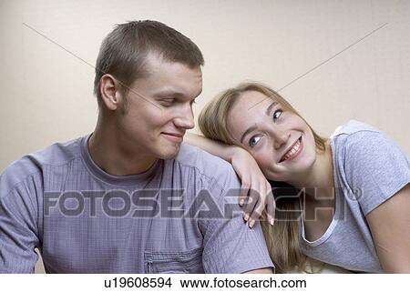 Young woman leaning on shoulder of young man View Large Photo Image Picture - Young woman leaning on shoulder of young man. Fotosearch