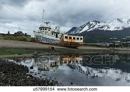 Ships and shipwrecks in Ushuaia harbour, Argentina View Large Photo Image Picture - Ships and shipwrecks in Ushuaia harbour, Argentina. Fotosearch