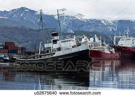 Stock Image - Ships and shipwrecks in Ushuaia harbour, Argentina. Fotosearch