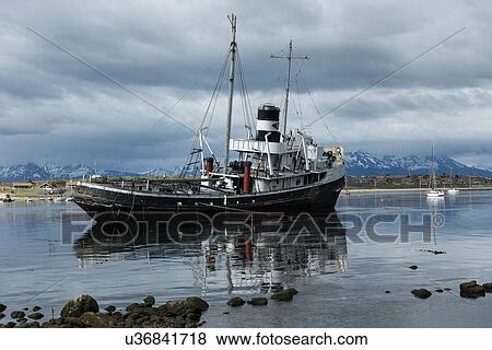 Ships and shipwrecks in Ushuaia harbour, Argentina View Large Photo Image Stock Photo - Ships and shipwrecks in Ushuaia harbour, Argentina. Fotosearch