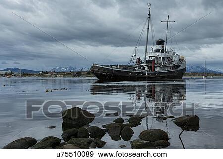 Ships and shipwrecks in Ushuaia harbour, Argentina View Large Photo Image Stock Photo - Ships and shipwrecks in Ushuaia harbour, Argentina. Fotosearch