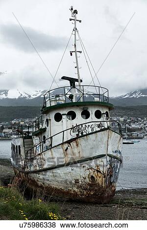 Stock Photo - Ships and shipwrecks in Ushuaia harbour, Argentina. Fotosearch