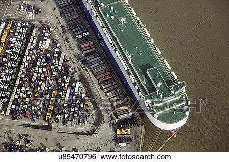 Auto transporter being unloaded View Large Photo Image Stock Photograph - Auto transporter being unloaded. Fotosearch