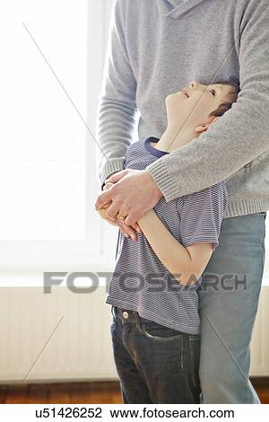 Boy showing affection to father View Large Photo Image Stock Image - Boy showing affection to father. Fotosearch