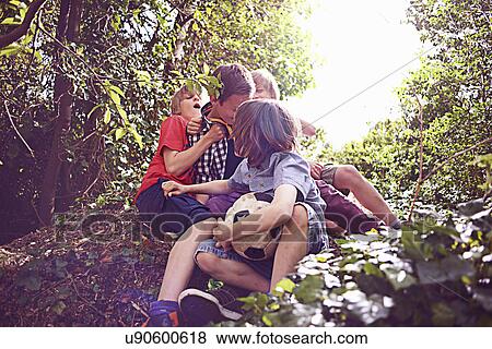 Boys playing in forest View Large Photo Image Stock Photo - Boys playing in forest. Fotosearch