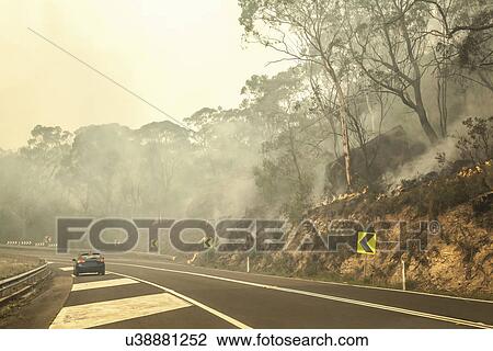 Stock Image - Bush fire and highway, New South Wales, Australia. Fotosearch