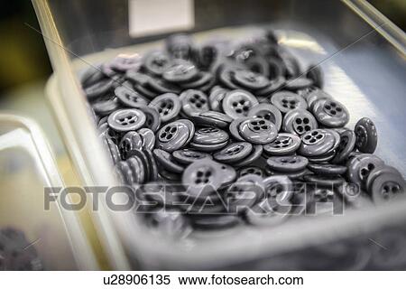Buttons in clothing factory, close up View Large Photo Image Stock Photography - Buttons in clothing factory, close up. Fotosearch