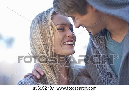 Stock Photo - Close up of romantic young couple. Fotosearch
