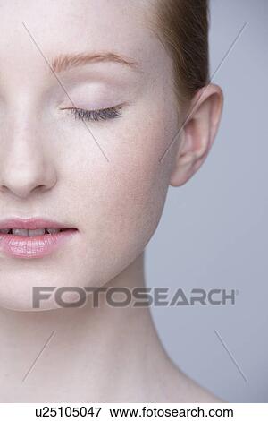 Close up portrait of young woman, eyes closed View Large Photo Image Stock Photo - Close up portrait of young woman, eyes closed. Fotosearch