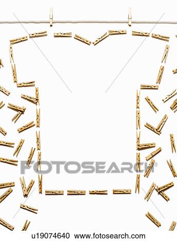 Stock Image - Clothes line and white tshirt outlined with clothespins. Fotosearch