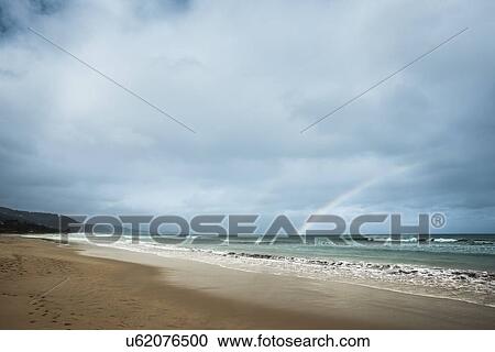 Stock Image - Coastal view with double rainbow, Victoria, Australia. Fotosearch