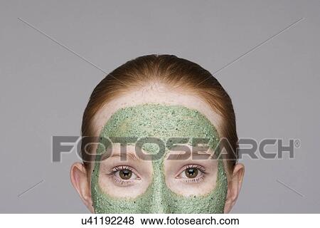 Cropped image of young woman wearing face mask View Large Photo Image Stock Photo - Cropped image of young woman wearing face mask. Fotosearch