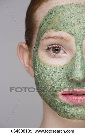 Cropped image of young woman wearing face mask View Large Photo Image Stock Photography - Cropped image of young woman wearing face mask. Fotosearch