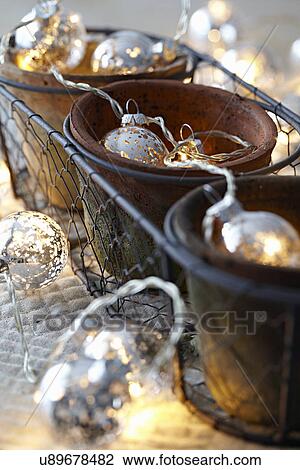 Stock Image - Decorative lights in plant pots. Fotosearch