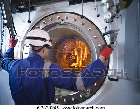 Engineer with fuel rod handling machine in nuclear power station View Large Photo Image Stock Photography - Engineer with fuel rod handling machine in nuclear power station. Fotosearch
