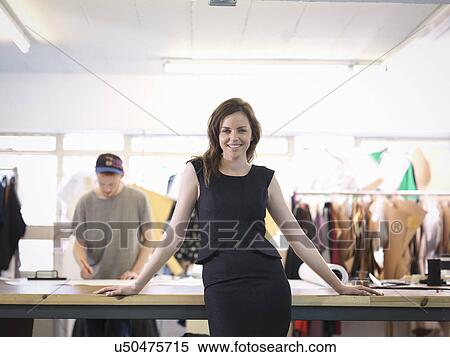 Stock Photography - Fashion designer in fashion studio, portrait. Fotosearch