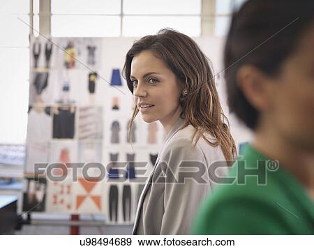 Stock Photo - Fashion designers in fashion design studio. Fotosearch