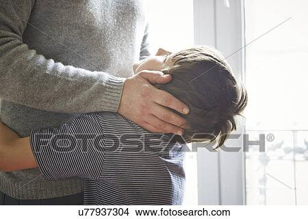 Father and son hugging View Large Photo Image Picture - Father and son hugging. Fotosearch